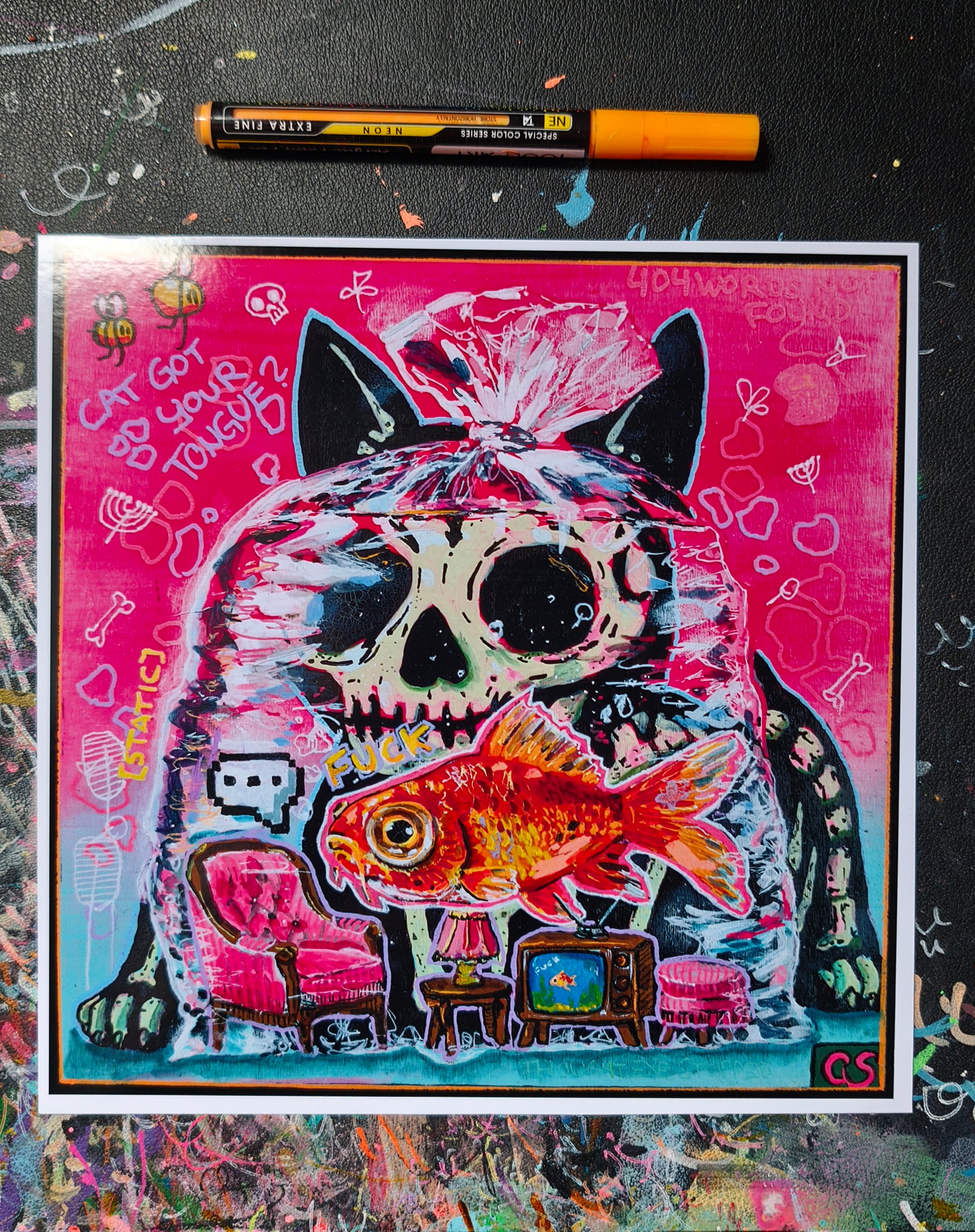 Colorful pop-surreal artwork titled Cat Got Your Tongue? featuring a large black cat with a skull-like face staring over a goldfish trapped inside a transparent plastic bag. Tiny furniture, including a pink armchair, lamp and vintage television, sits inside the bag beneath the fish. The background is neon pink and turquoise with handwritten doodles, bones, bees and playful symbols.