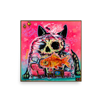 Colorful pop-surreal artwork titled Cat Got Your Tongue? featuring a large black cat with a skull-like face staring over a goldfish trapped inside a transparent plastic bag. Tiny furniture, including a pink armchair, lamp and vintage television, sits inside the bag beneath the fish. The background is neon pink and turquoise with handwritten doodles, bones, bees and playful symbols.