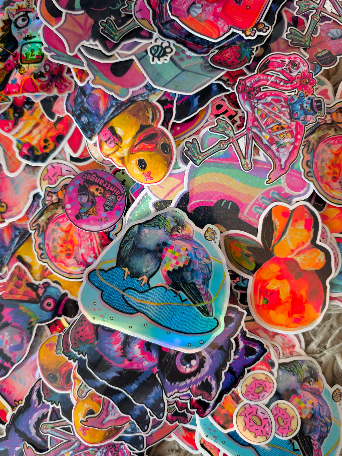 A colourful assortment of Paintranger art stickers, showing example designs for the surprise sticker pack