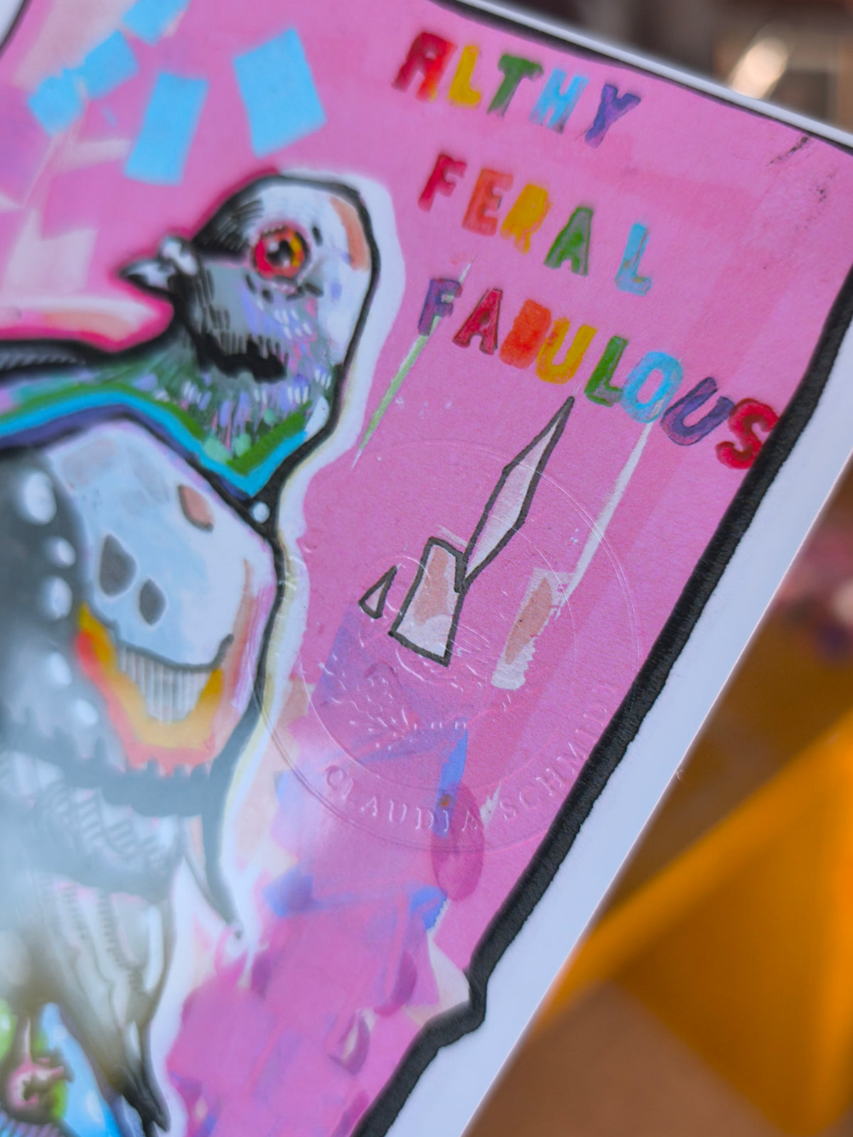 Close-up of the Living Room Studies No. 2 pigeon postcard and embossed Paintranger artist stamp